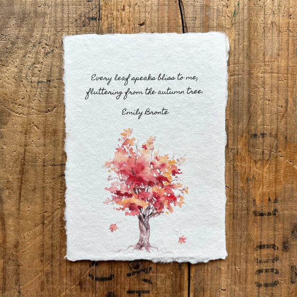 Emily Brontë's quote "Every leaf speaks bliss to me, fluttering from the autumn tree" on handmade paper