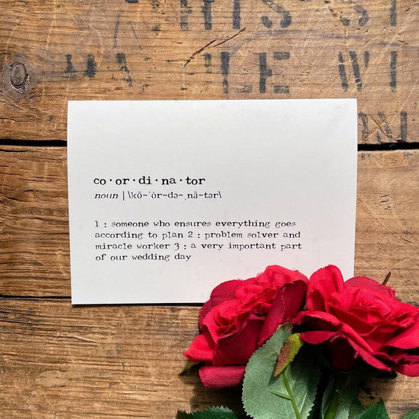 coordinator definition greeting card in typewriter font with an envelope and red rose sticker seal.