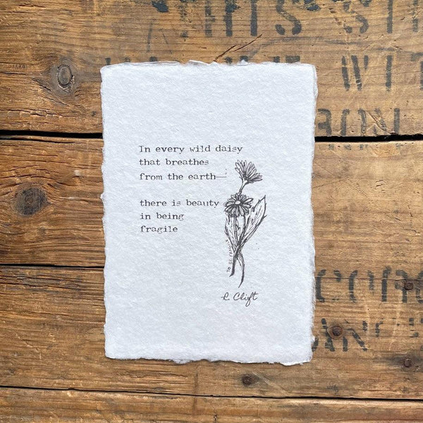 "In every wild daisy that breathes from the earth—there is beauty in being fragile" poem by R. Clift with an original doodle of daisies, printed on handmade paper. 