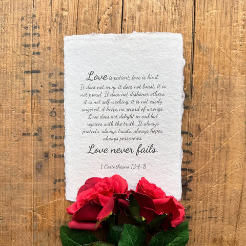 Love is patient, love is kind 1 Corinthians 13:4-8 scripture in script font on handmade paper