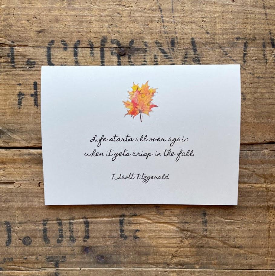 F. Scott Fitzgerald's quote "Life starts all over again when it gets crisp in the fall." on a blank notecard with original fall leaves watercolor image by artist Patricia Shaw.