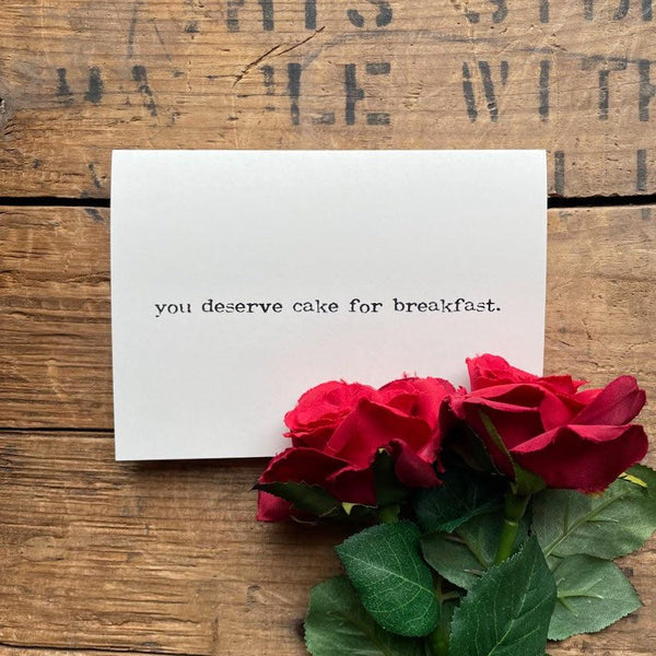 you deserve cake for breakfast compliment card in typewriter font with envelope and rose sticker - Alison Rose Vintage