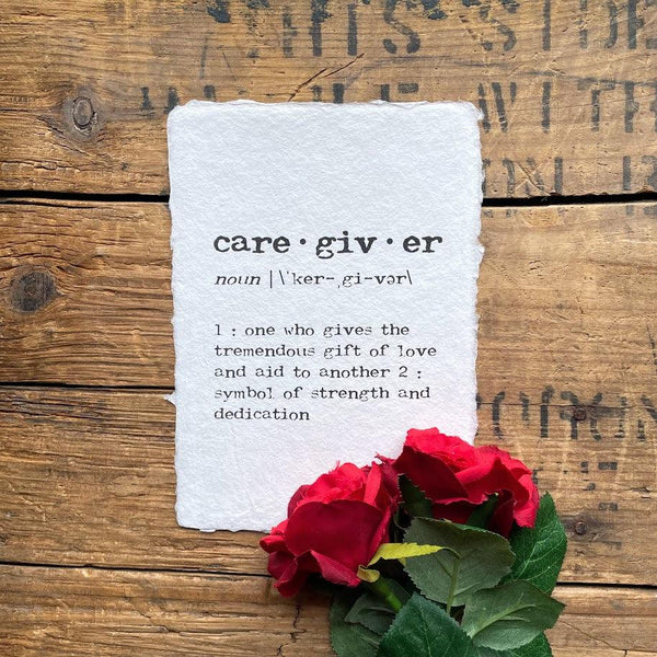 caregiver definition print in typewriter font on handmade cotton rag paper.
