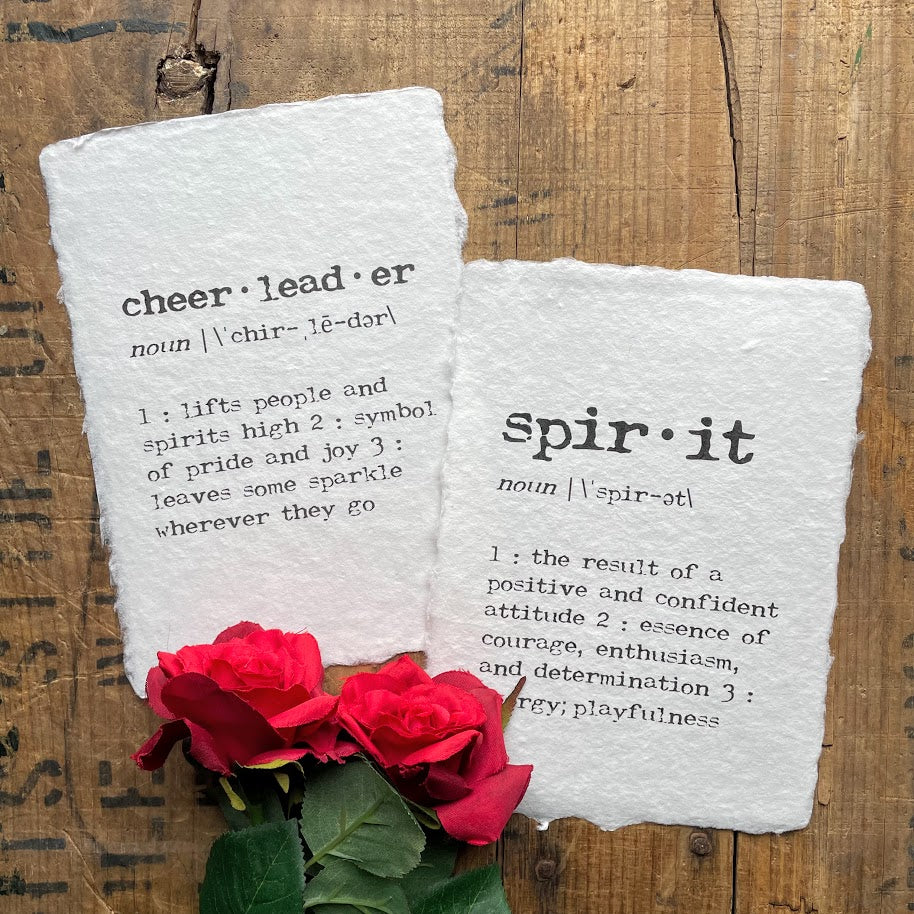 Cheerleader definition print in typewriter font on handmade cotton rag paper.