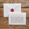 all things christmas greeting card in typewriter font with string of lights watercolor image by artist Patricia Shaw with envelope and rose sticker seal.