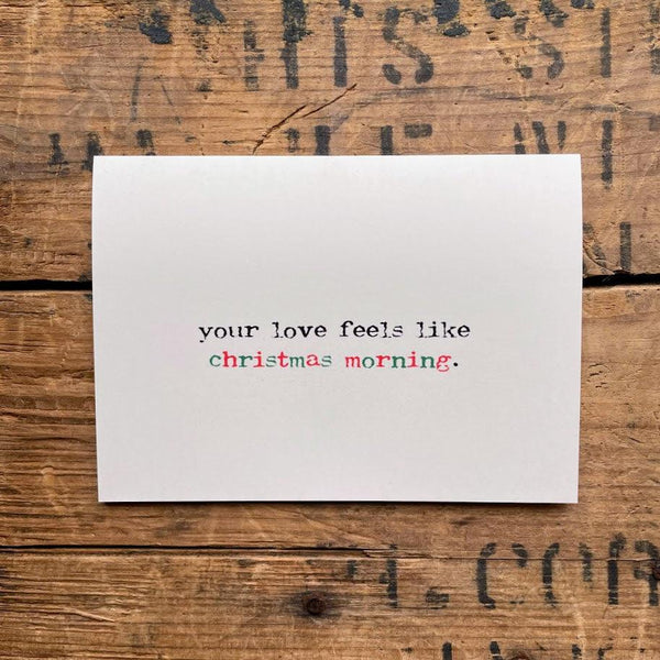 your love feels like christmas morning compliment greeting card with envelope and rose sticker seal.