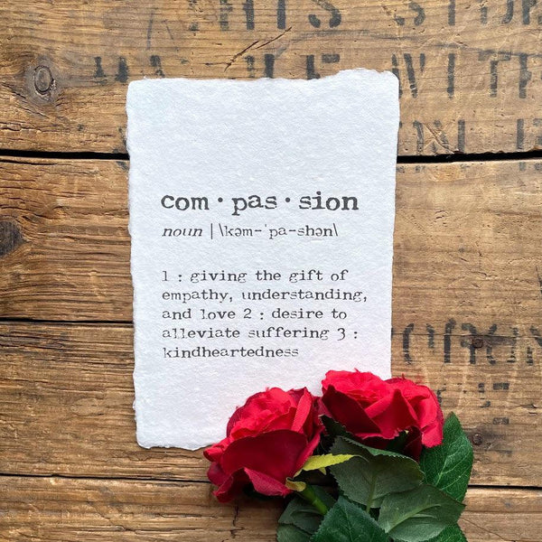 compassion definition print in typewriter font on handmade cotton rag paper. 