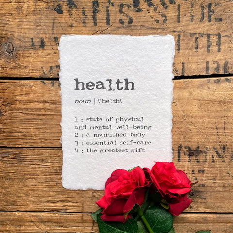 health definition print in typewriter font on handmade cotton rag paper.