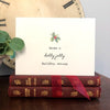 have a holly jolly holiday season greeting card in typewriter font with envelope and rose sticker - Alison Rose Vintage