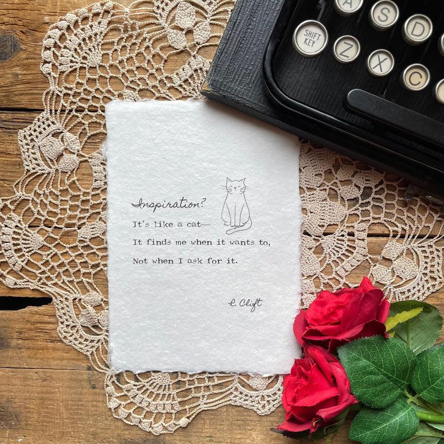 "Inspiration? It's like a cat—it finds me when it wants to, not when I ask for it." poem by R. Clift with an original cat doodle, printed on handmade paper. 