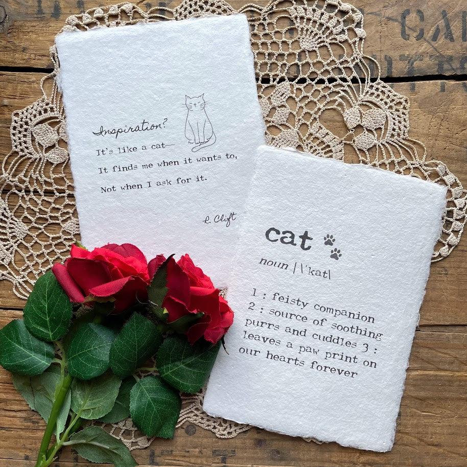 "Inspiration? It's like a cat—it finds me when it wants to, not when I ask for it." poem by R. Clift with an original cat doodle, printed on handmade paper. 