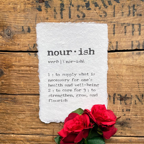 nourish definition print in typewriter font on handmade cotton rag paper.