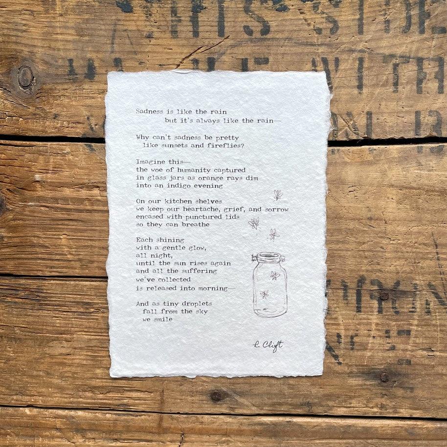 R. Clift poem about sadness printed on handmade paper with an original jar and fireflies doodle. 