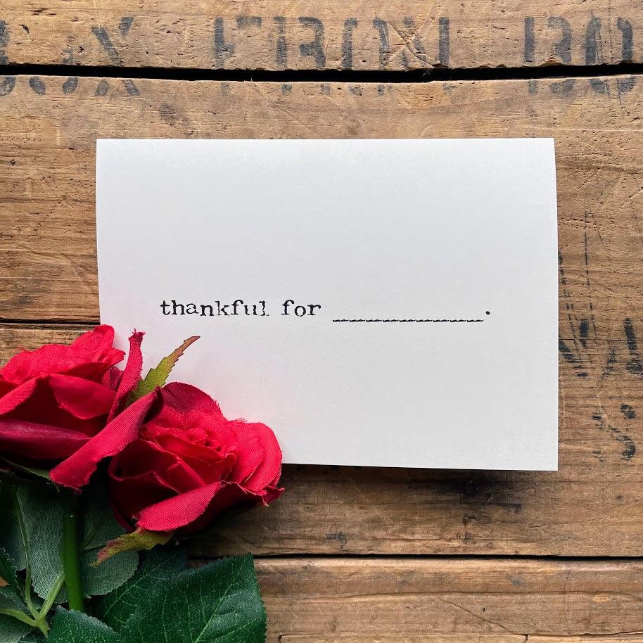 thankful for "blank" greeting card in typewriter font with envelope and rose sticker.