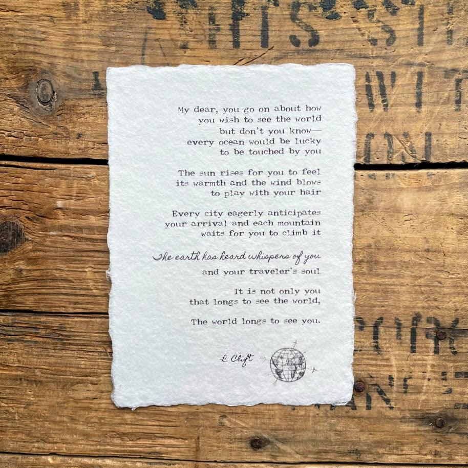 The world longs to see you travel poem by R. Clift on handmade paper
